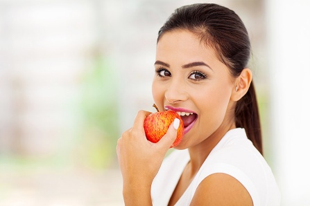 Woman Eating Apple image